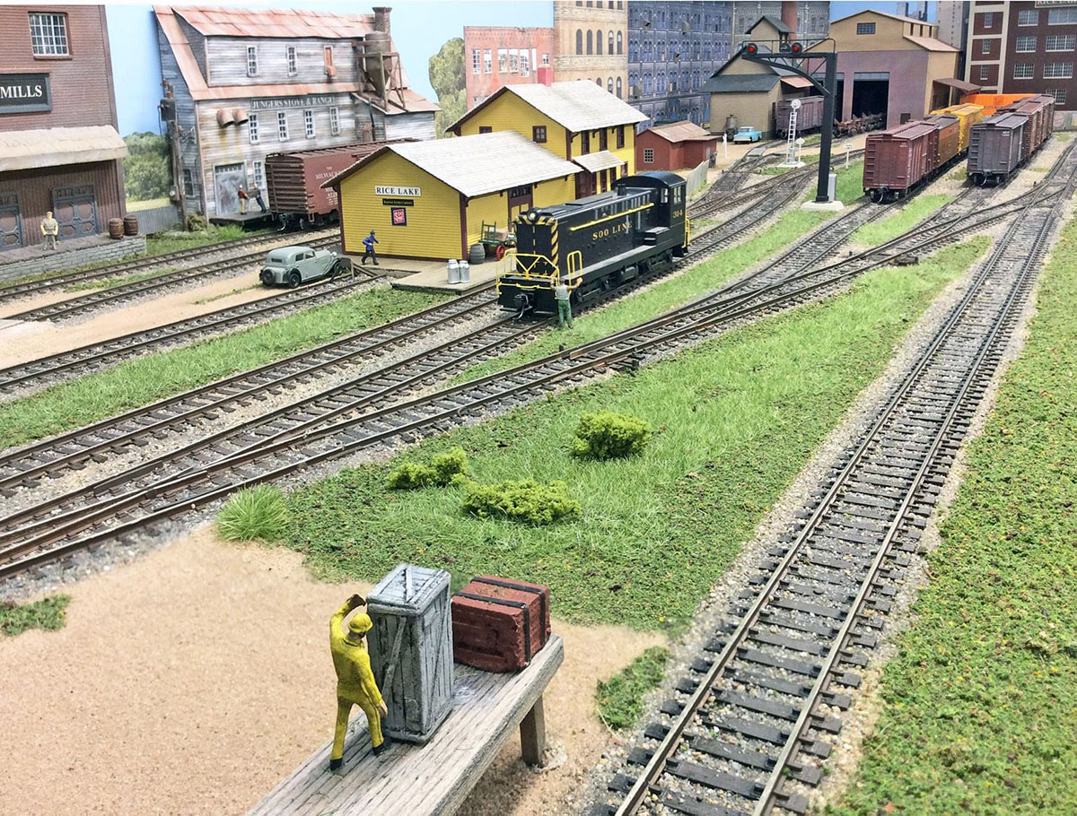 A scene at the Rice Lake area on Bob Wundrock's HO scale Rice Lake, Dallas & Menomonie Railroad. This photograph is an iPad <em>Photo Stacked</em> composition. Bob is a SCWD member.