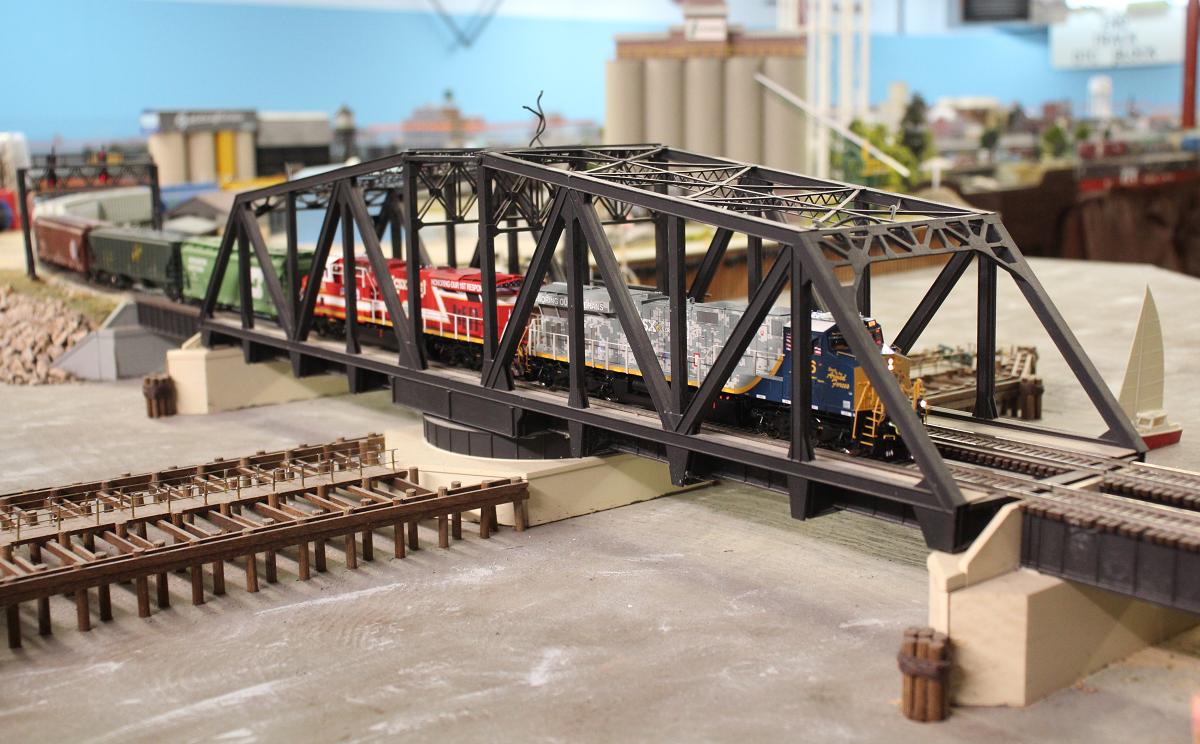 Two of CSX's tribute locomotives on a freight crossing the St Joseph River